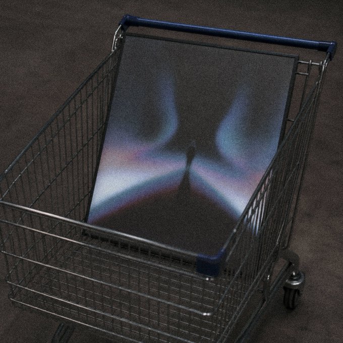 A shopping cart contains a dark screen or tablet displaying a symmetrical, colorful, blurry pattern.