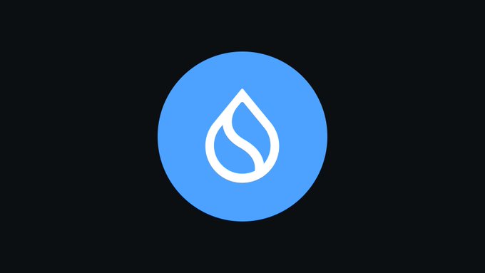 The image shows an illustration of a blue water droplet with a white outline against a black background. The water droplet is positioned centrally in the frame, drawing attention to its shape and color. There are no other objects or text present in the image, making it a simple yet striking visual representation of a water droplet.