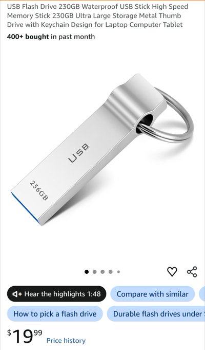 An Amazon product listing for a 256GB USB Flash Drive with a metal thumb drive design and keychain, priced at $19.99, showing '400+ bought in past month'.