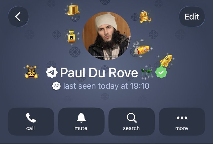 Telegram profile page for "Paul Du Rove," showing a level 87 badge, last seen today at 19:10, and a circular profile photo of a bearded man in a white beanie and plaid hoodie, surrounded by various animated stickers and emoji collecting around the avatar—aligning with the post's praise for his standout profile picture.