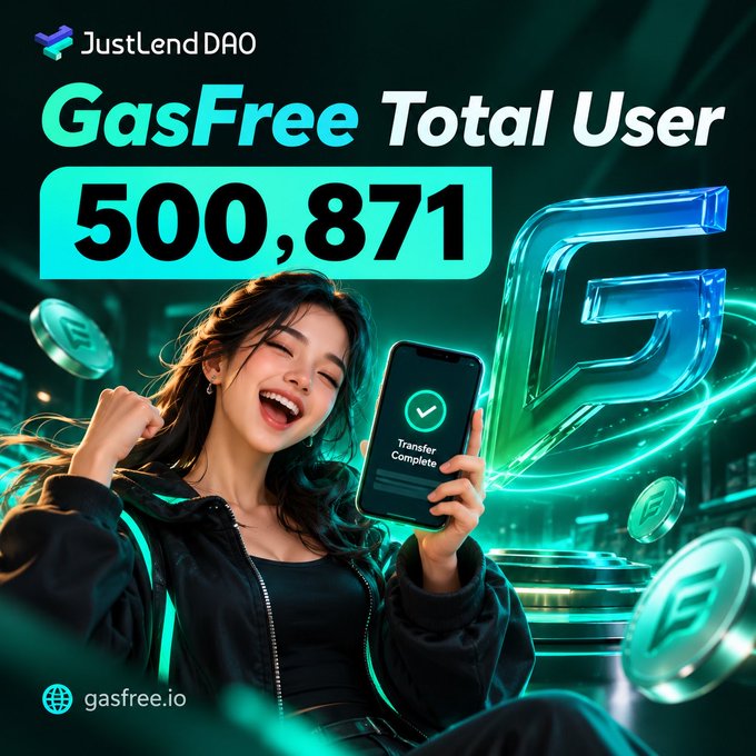 A promotional graphic for JustLend DAO celebrating 'GasFree Total User 500,871', featuring an excited young woman holding a smartphone showing a 'Transfer Complete' notification.