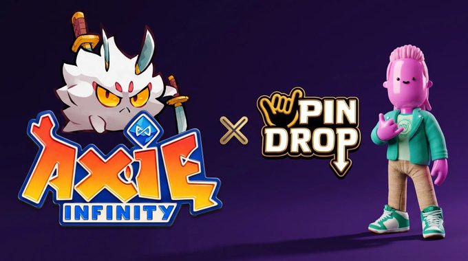 The image is a promotional graphic announcing a collaboration between "Axie Infinity" and "Pin Drop," featuring the Axie Infinity logo with its white horned mascot on the left and the Pin Drop logo alongside a pink-haired character in a teal jacket on the right, separated by an "x" symbol on a purple background. This visual aligns with the post celebrating the distribution of Axie Pin Drop event rewards to eligible winners who connected their wallets to their profiles.