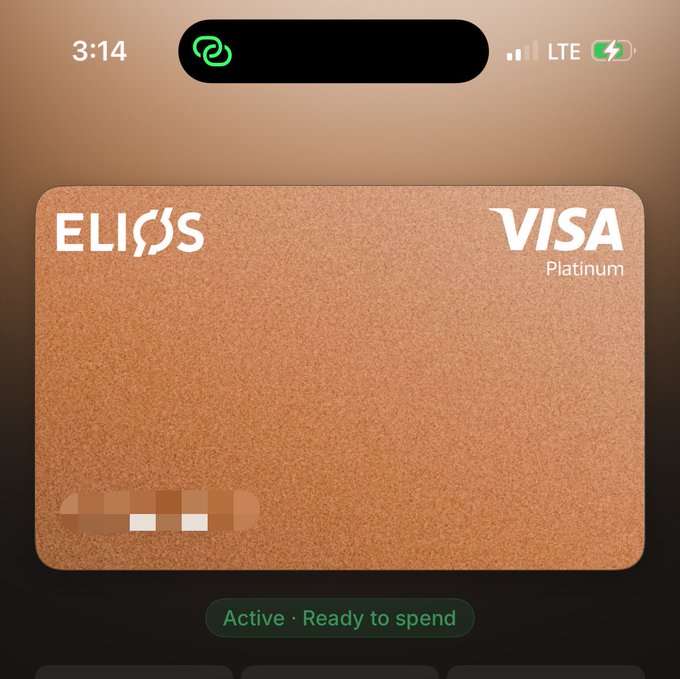 Apple Wallet screenshot of an 'ELIOS' Visa Platinum credit card with a textured copper/orange design, showing status 'Active · Ready to spend.'