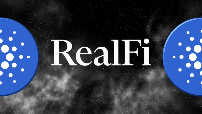 The image displays the text "RealFi" in white serif font centered against a dark, starry cosmic background, flanked by two blue Cardano (ADA) logos. The graphic serves as a visual header for a Cardano news update announcing the launch of RealFi's testnet, highlighting both the project's name and its connection to the Cardano blockchain ecosystem.