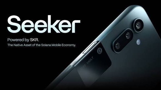 A promotional image for 'Seeker' powered by SKR, described as 'The Native Asset of the Solana Mobile Economy,' featuring a close-up of a smartphone with a 'SEED VAULT' compartment visible on its side.