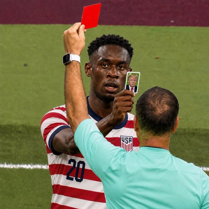 A USA soccer player wearing jersey number 20 receives a red card from a referee, with someone holding up a Donald Trump card in the foreground, referencing Tim Weah's red card incident.