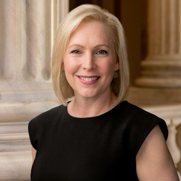 This appears to be an official portrait of Senator Kirsten Gillibrand, a blonde woman with shoulder-length hair wearing a black sleeveless top, photographed against a classical architectural background with columns. The image relates to the accompanying post as it depicts the Senator who is reportedly privately urging fellow Democrats to advance the CLARITY Act.