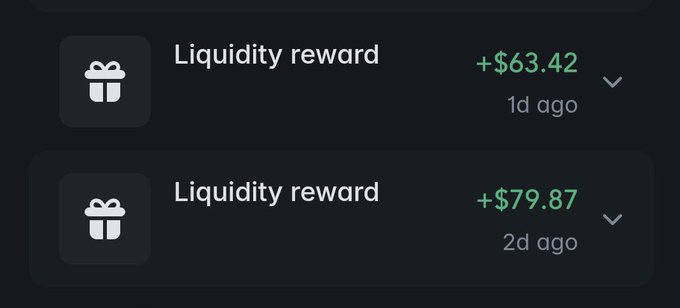 The image shows two recent liquidity rewards of +$63.42 (1 day ago) and +$79.87 (2 days ago) accumulating on a crypto wallet dashboard. This visualizes the user's "still printing" sentiment, as passive liquidity rewards continue to deposit into their wallet day after day.