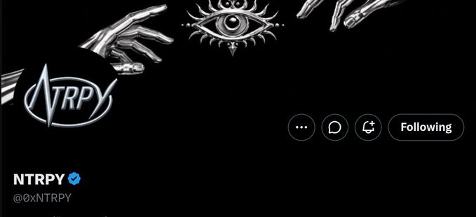 A Twitter/X profile for 'NTRPY' (@0xNTRPY) with a verified checkmark, featuring a black banner with metallic silver hands, an eye symbol, and the NTRPY logo.