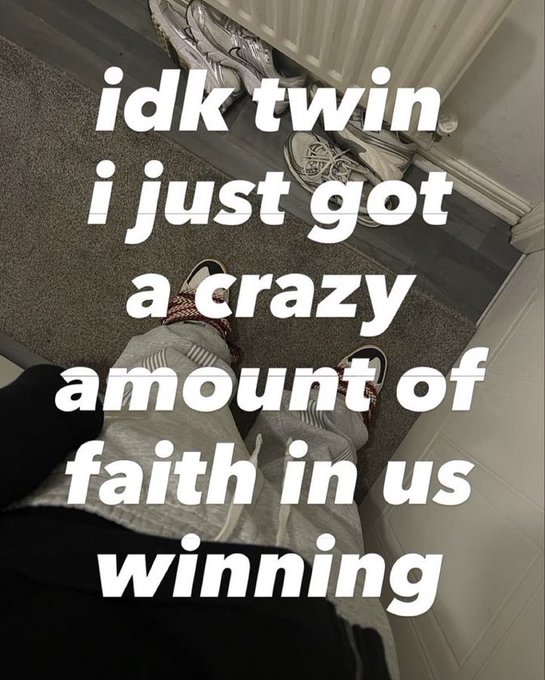 A first-person view looking down at someone's feet wearing socks and sandals, with text overlay reading 'idk twin i just got a crazy amount of faith in us winning'.