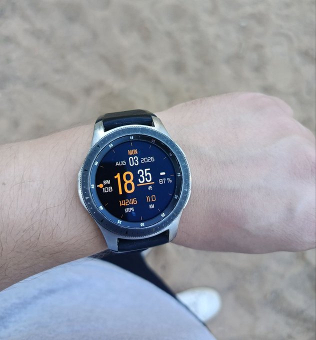 A smartwatch on a person's wrist displaying the time 18:35, date MON AUG 03 2026, BPM 108, battery at 67%, 14206 steps, and 11.0 KM.