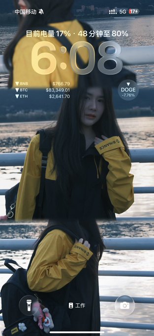 A phone lock screen displaying the time '6:08' and crypto prices including BNB ($766.78), BTC ($83,349.01), and ETH ($2,641.70), overlaid on a photo of a young woman in a yellow jacket by a railing.