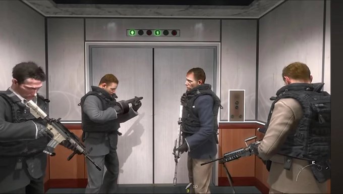 A screenshot from a video game showing four armed men in tactical gear standing in an elevator.