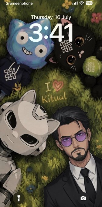 A phone lock screen displaying "Thursday, 16 July 3:41" and "I ❤ Kitual" written in the grass, featuring a blue cartoon creature, a black cat, a robot, and an illustrated man in a suit with purple glasses, matching the post's gratitude to @ritualnet and @KeybiNFT_ for creating a themed wallpaper promoting "I ❤ Ritual" with related accounts.