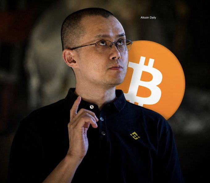 A man wearing glasses and a black polo shirt with a Binance logo stands in front of a Bitcoin symbol, with 'Altcoin Daily' text visible in the corner.