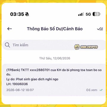 A smartphone screenshot showing a Vietnamese banking notification from Vietcombank titled 'Thông Báo Số Dư/Cảnh Báo' warning that account (TPBank) TKTT xxx2880701 has been locked due to identity fraud.