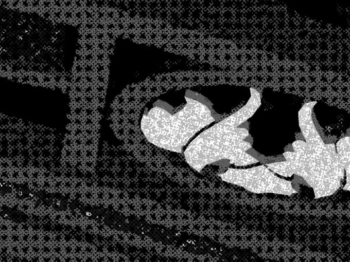 A grainy, high-contrast black and white image resembling a heavily filtered or corrupted close-up of an eye or organic shape.