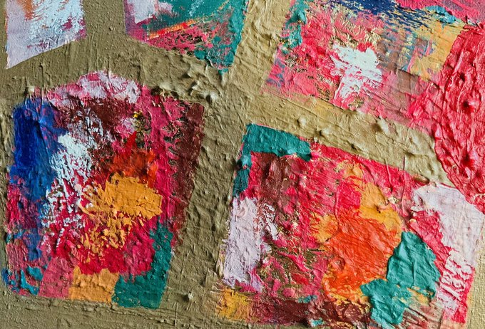 A close-up of textured artwork with crumpled gold paper layered beneath colorful paint patches in red, blue, green, orange, and white.
