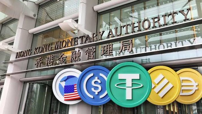 The image shows the exterior of the Hong Kong Monetary Authority (HKMA) building, with large circular emblems below the signage displaying logos representing various currencies and digital assets, including the USD dollar sign, Tether (USDT), and other stablecoins. The post discusses the HKMA's response regarding rumors of a second batch of stablecoin issuer licenses potentially being issued around China's National Day holiday, noting the authority's open yet cautious stance with no clear timeline.