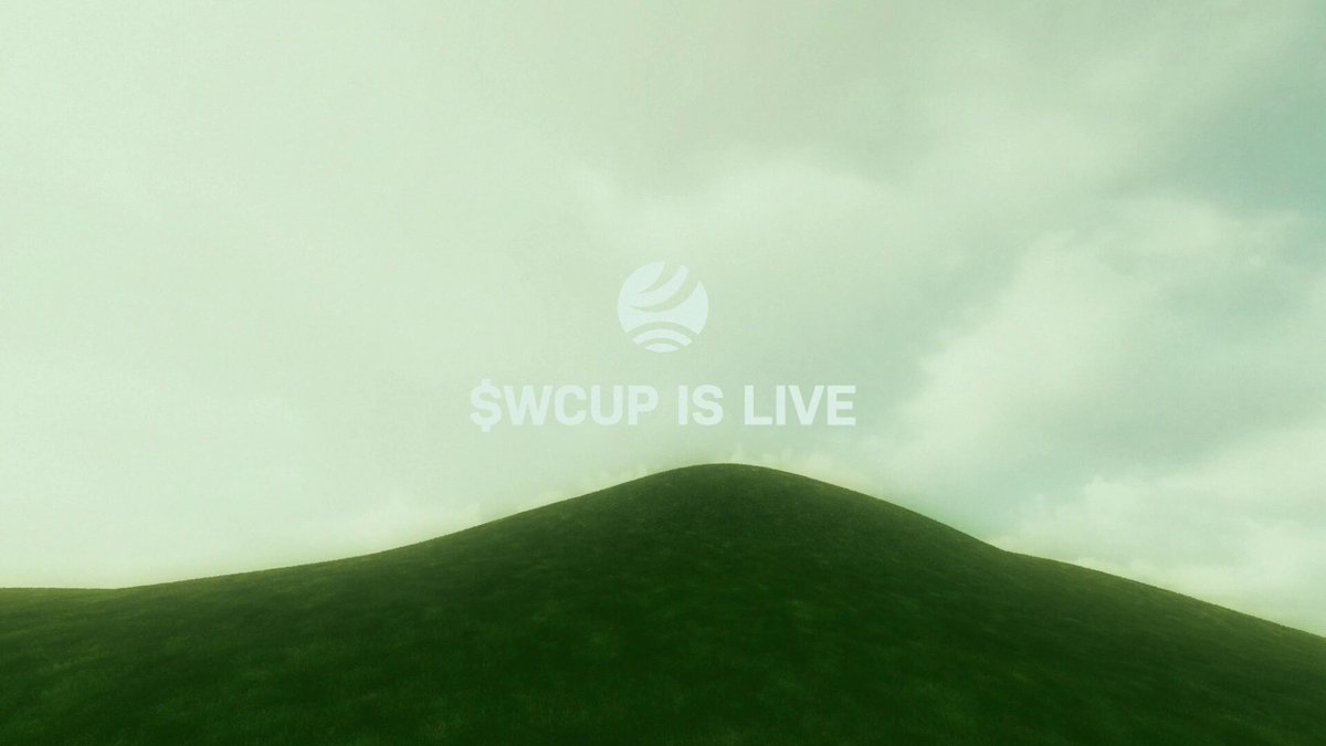 The image shows a green hill with a white sign that says "SWC Is Live" written on top of it, indicating that there's an event happening at this location. The background features a cloudy sky, which adds to the overall atmosphere of the scene.