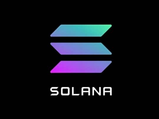The image displays the Solana cryptocurrency logo, featuring three stacked horizontal parallelograms in a gradient of teal, blue, and purple, with the word "SOLANA" in white text below against a black background. This visual serves as the core of a bullish promotional post, with the user sharing the official branding as part of a campaign to rally enthusiasm for Solana reaching a new all-time high.