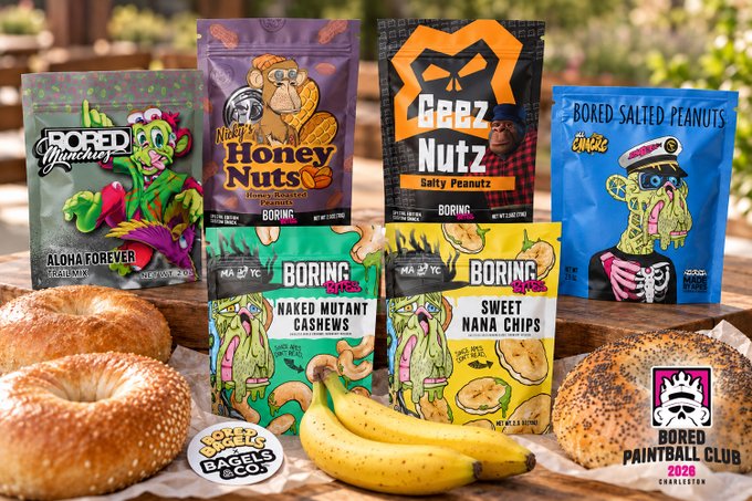 A product display for "Bored Paintball Club 2020" snacks including various bags of "Boring Snacks" peanuts and cashews alongside bagels and bananas.