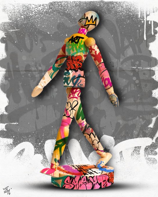 The image features a colorful, graffiti-covered wooden sculpture of a person walking across a white surface. The sculpture has a unique design with various colors and patterns that make it stand out against the backdrop. The text "GM Urban Exorcism" is present in the image, which could be related to the artist's name or an artistic concept behind the piece.