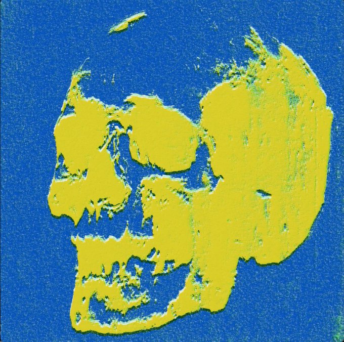 An Andy Warhol-style pop art print of a skull rendered in yellow against a textured blue background.