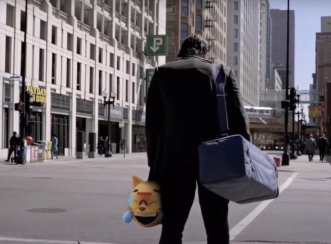 A man in a black coat walks down a city street carrying a briefcase and a cartoon cat mascot plush toy, symbolizing the lone "hodler" journeying toward the promised $100 billion market cap for $mog coin, which currently sits at just $0.04 billion on Day 513.