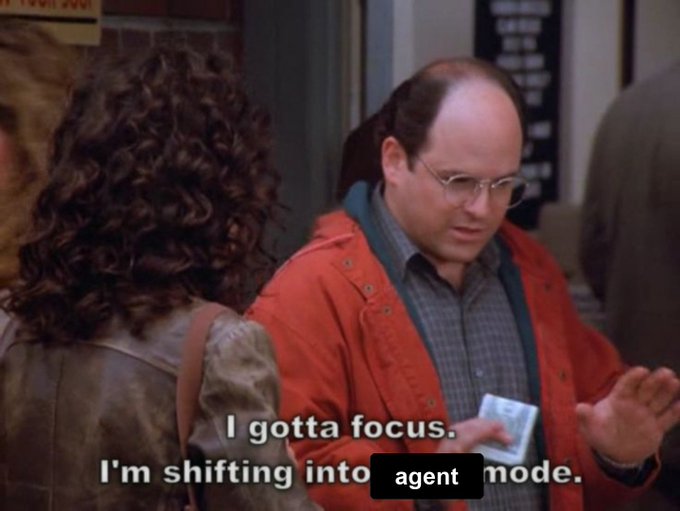 George Costanza from Seinfeld says "I gotta focus. I'm shifting into agent mode," while gesturing with a small object in his hand. The caption humorously illustrates the relatable struggle of staying on a simple task before inevitably turning it into a complex multi-agent workflow.