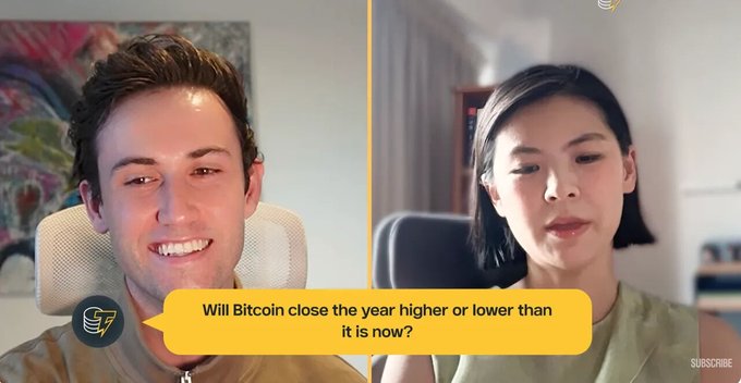 A split-screen interview features a smiling man on the left and Bitget CEO Gracy Chen on the right, with a yellow caption box displaying "Will Bitcoin close the year higher or lower than it is now?" The image visually represents the post's discussion of Chen's prediction that Bitcoin could end the year $10,000 to $20,000 above or below its current price.