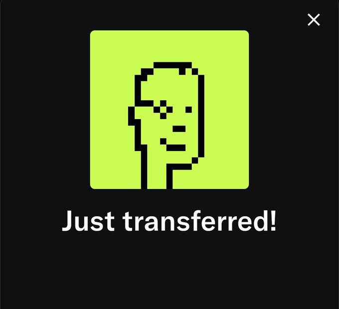 A pop-up with a pixelated green face icon and the text "Just transferred!" appears over a dark background, mimicking a Robinhood transfer notification—likely used to falsely imply a crypto/NFT giveaway was sent in a common scam tactic.