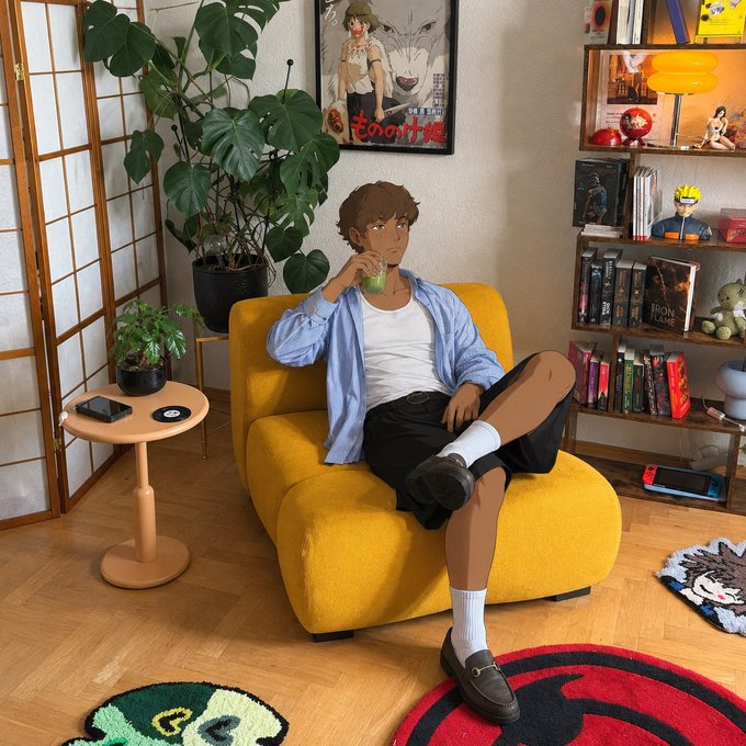 An illustration of a young man in a blue shirt and white tee sitting on a yellow chair drinking a green beverage in a cozy room with bookshelves, plants, and anime posters including 'Mononoke'.