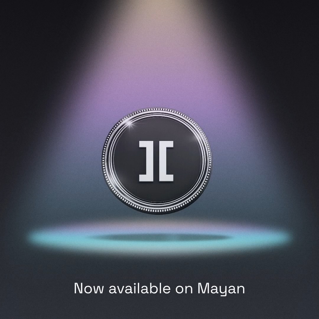 A glowing circular emblem featuring the white "JC" logo is illuminated by a spotlight against a dark background, with the caption "Now available on Mayan" displayed below. The image visually represents the announcement of $BOT from @RoboStrategy now being accessible for swapping on the Mayan platform.