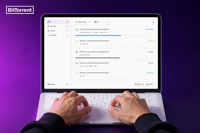 The image shows two hands typing on a laptop keyboard while browsing through a web page about Bit Torrent Neo. The person's fingers are visible as they type, indicating that they are actively engaged with the content displayed on the screen. The background of the image is purple, which contrasts with the white keys and the black laptop. The text in the image reads "If you'r looking for a cleaner, faster way to manage your transfers on Mac", suggesting that the person might be interested in learning more about Bit Torrent Neo or considering using it as a tool for managing their file transfers.