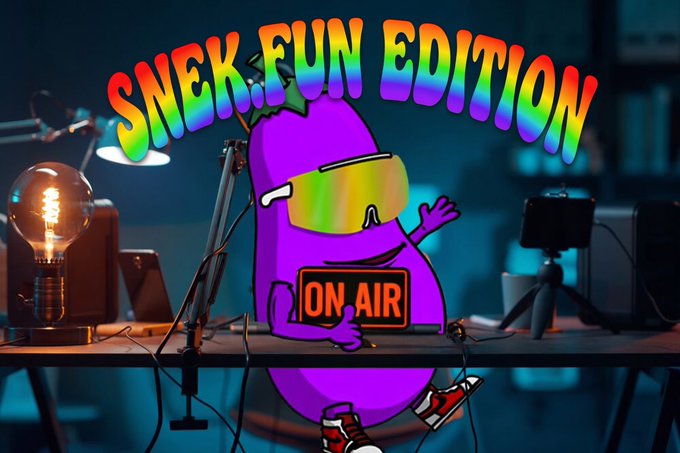 The image features a purple cartoon character with sunglasses sitting at a desk surrounded by various electronic equipment such as a laptop, cell phone, camera, and microphone. The text "Snek Fun Edition" is written above the character's head, indicating that this is an edition of the cartoon series. The post also mentions that there will be a special Space event on Wednesday at 7:30 PM EST with other participants joining in for a fun time.