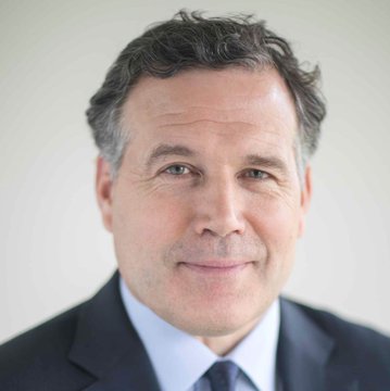 A professional headshot shows a middle-aged man with short, dark hair and a slight smile, wearing a dark suit jacket, light blue dress shirt, and dark tie against a plain background. The image appears to be an official portrait associated with Senator McCormick, accompanying his statement urging the Senate to advance the CLARITY Act.