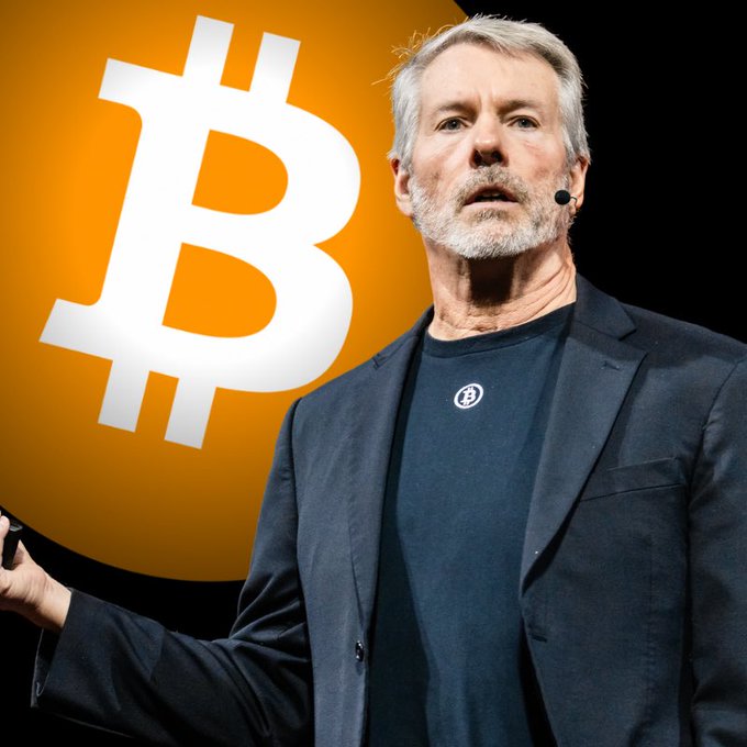 MicroStrategy CEO Michael Saylor speaks on stage in front of a large Bitcoin logo, likely during a presentation promoting Bitcoin investment—aligning with the post highlighting Strategy's addition of $225 million to its USD reserves, bringing total cash holdings to $3.2 billion.