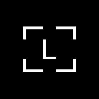 The image shows a white viewfinder or focus bracket icon on a black background, resembling a camera's targeting frame. This visual likely symbolizes the act of "targeting" or "zooming in" on the crypto security issue, as the accompanying post highlights Ledger users being targeted in a reported $86-87M drain involving potentially tampered devices sold through CryptoBilis in Southeast Asia.