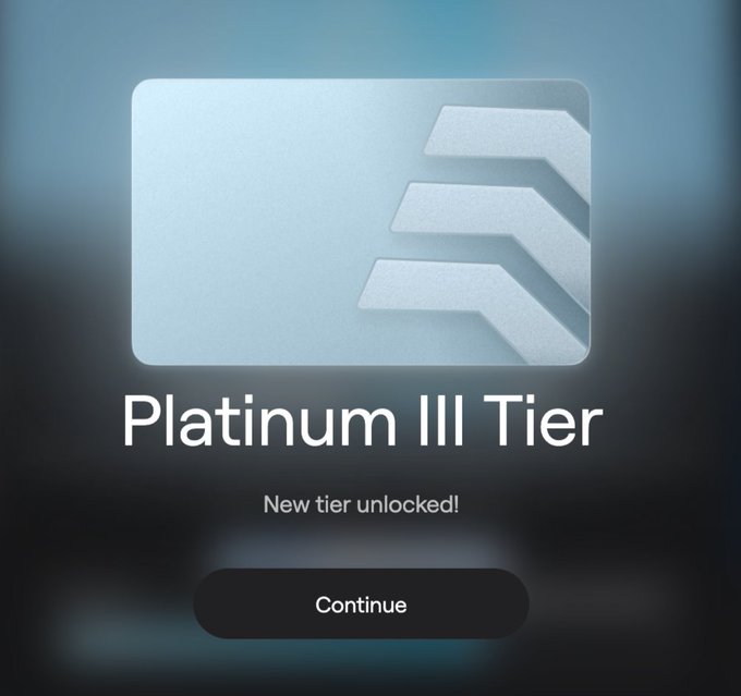 A notification screen displaying a silver 'Platinum III Tier' badge with the text 'New tier unlocked!' and a 'Continue' button below.