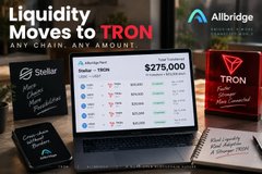 An advertisement for Allbridge showing a laptop displaying a $275,000 liquidity move to TRON, with the headline 'Liquidity Moves to TRON ANY CHAIN, ANY AMOUNT.'