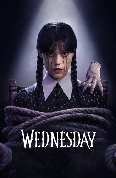 A promotional image for the show 'Wednesday' features a young woman with braided pigtails in a dark, patterned dress, looking directly at the camera as a severed hand rests on her shoulder.