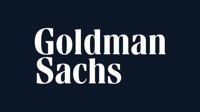 The image displays the Goldman Sachs logo in white serif text on a dark navy background, connecting to the post about the firm channeling its ~$100B Treasury fund (FTIXX) into institutional crypto rails via Lynq on a private Avalanche L1.