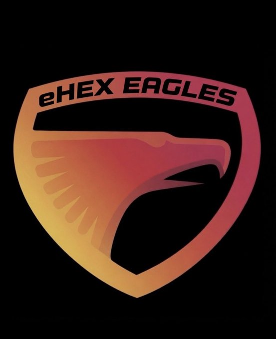 The image features a logo of an eagle with its wings spread wide, positioned within a shield shape against a black background. The text "eHEX Eagles" is written above the eagle's head, indicating that this is the official logo for the Eagle High School Eagles Club.
