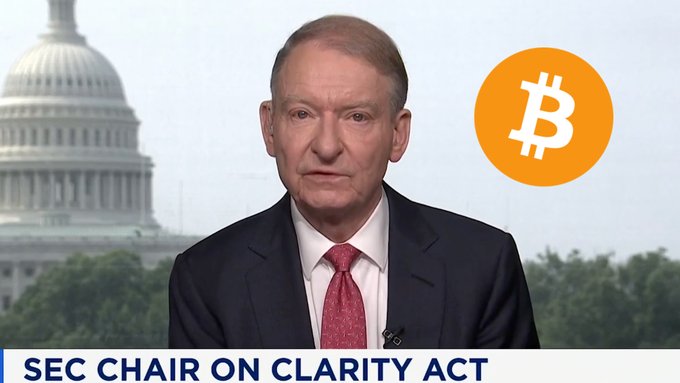 SEC Chair Paul Atkins appears on a news broadcast with a Capitol Building backdrop and Bitcoin logo, discussing his support for the Clarity Act as shown in the lower third graphic reading "SEC CHAIR ON CLARITY ACT."