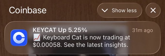 Coinbase notification showing KEYCAT up 5.25%, with text stating "Keyboard Cat is now trading at $0.00058."
