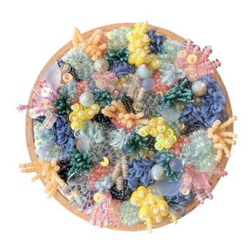 A circular wooden embroidery hoop displays a mixed-media textile artwork titled "Acroporia," featuring textured coral-like forms in pastel pinks, blues, yellows, and greens, accented with pearls and beadwork to mimic a vibrant reef ecosystem—priced at 0.375 ETH with the physical piece shipped to the buyer.