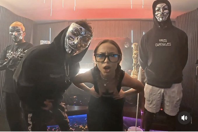 Three figures wearing reflective masks and a hooded sweatshirt reading "MAS CARNALES" stand behind a surprised-looking woman with glasses in a dimly lit room with red lighting, evoking a nostalgic, meme-worthy aesthetic that complements the post's "only real ones remember" sentiment tied to $SOL.