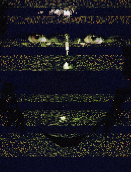 A distorted, glitchy image with horizontal bands of noise and static obscuring what appears to be figures in a dark setting, including a shadowy silhouette resembling a smiley face at the bottom.
