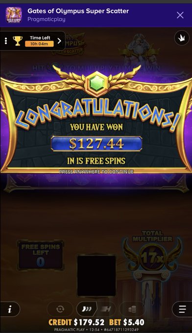 A screenshot from the slot game 'Gates of Olympus Super Scatter' by Pragmatic Play shows a 'CONGRATULATIONS! YOU HAVE WON $127.44 IN IS FREE SPINS' banner with a 17x total multiplier.